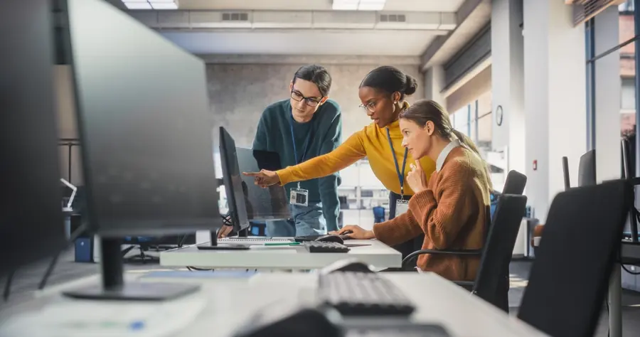 A development team reviewing work together